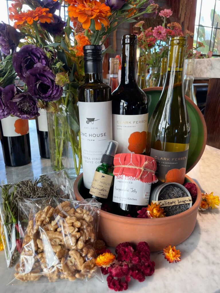 selection of zinc house farm store products and clark ferrea wines packaged in a terra cotta bowl